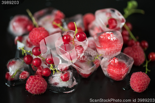 Image of Frozen berries on wooden table