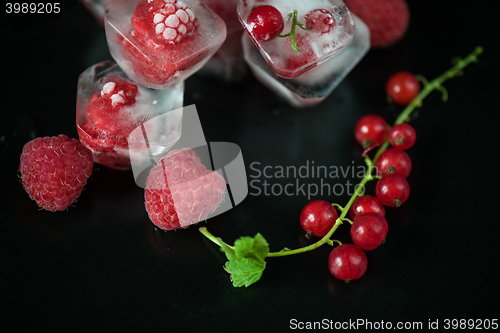 Image of Frozen berries on wooden table