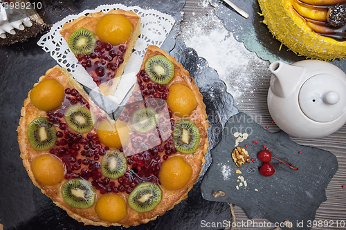 Image of Table with fruit cakes