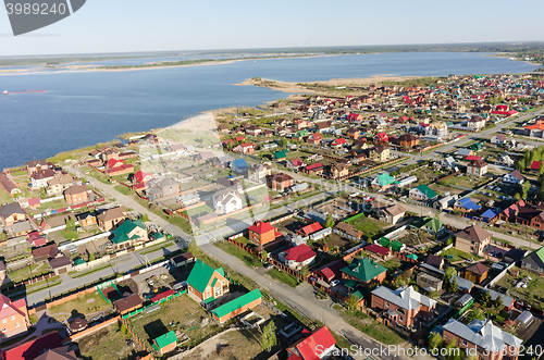 Image of Aerial view onto private houses on bank of lake