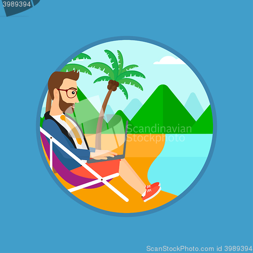 Image of Businessman working on laptop on the beach.