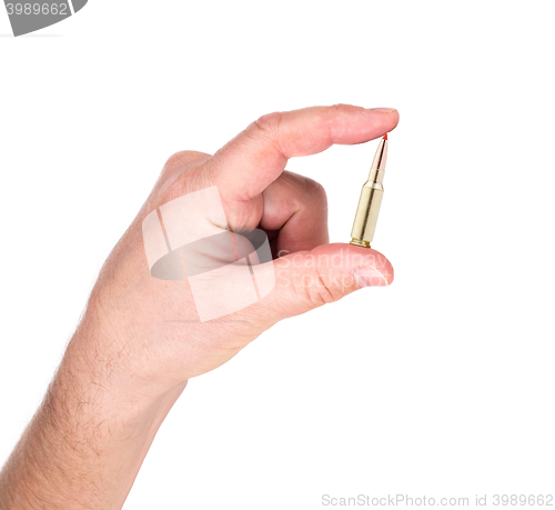 Image of hand holding bullet