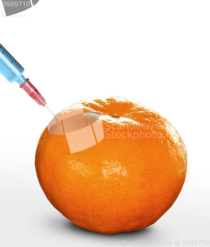 Image of syringe sticked into orange,GMO