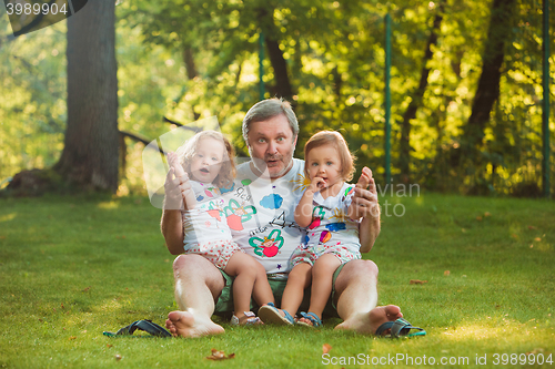 Image of Portrait Of Grandfather With Granddaughters