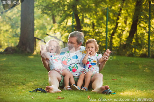 Image of Portrait Of Grandfather With Granddaughters