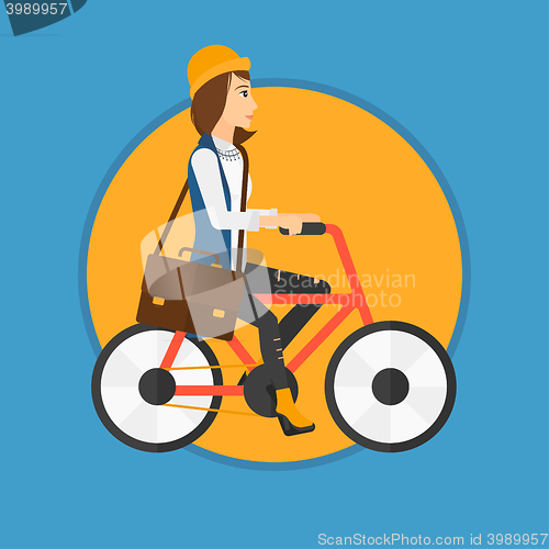 Image of Woman riding bicycle.