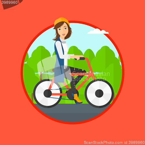 Image of Woman riding bicycle.