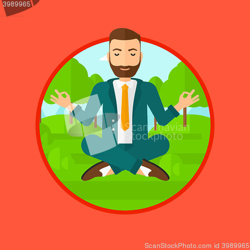 Image of Businessman meditating in lotus position.