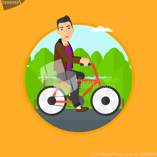 Image of Man riding bicycle.