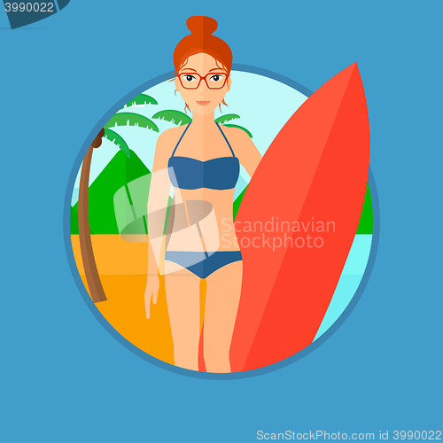 Image of Surfer holding surfboard.