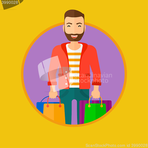 Image of Happy man with shopping bags.