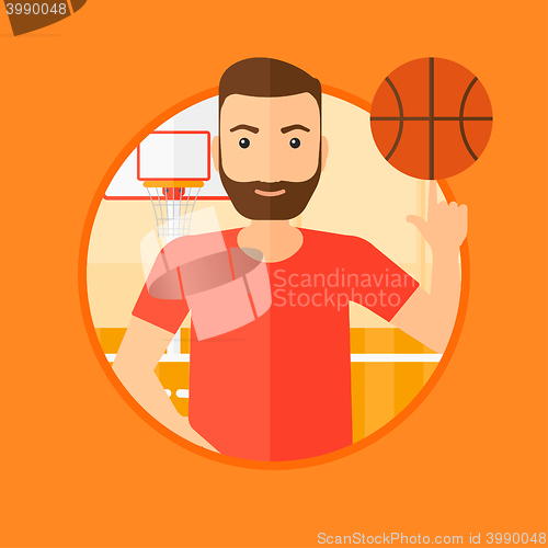 Image of Basketball player spinning ball.