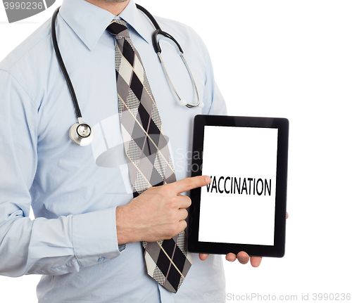 Image of Doctor holding tablet - Vaccination