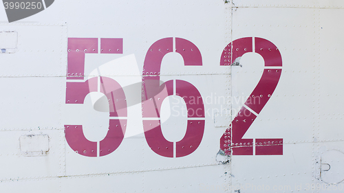 Image of Painted number on an old war plane