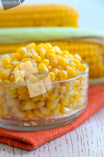 Image of Yellow steamed corn with salt and pepe