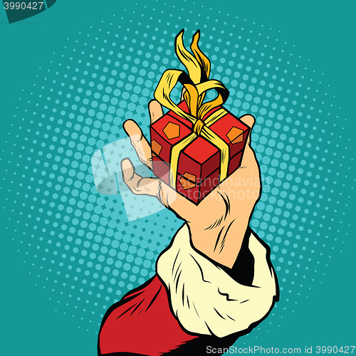 Image of Hand of Santa Claus with gift