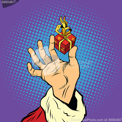 Image of Hand of Santa Claus and a small gift