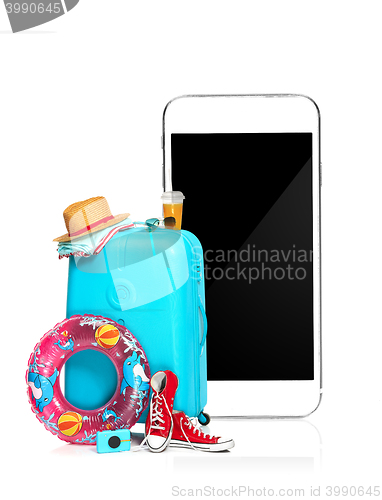 Image of The blue suitcase, sneakers, clothing, hat, and phone on white background.