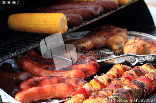 Image of grilled corn, sausages, skewer