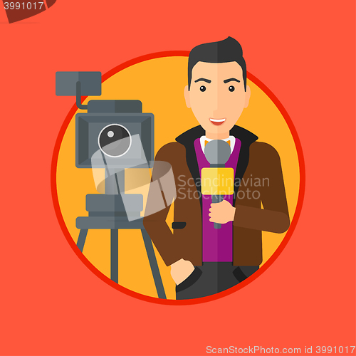 Image of TV reporter with microphone and camera.