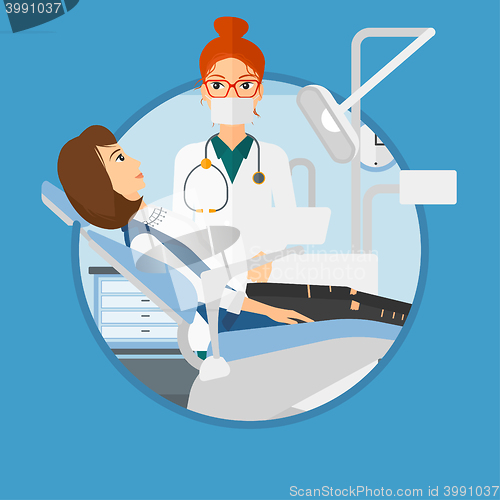 Image of Patient and doctor at dentist office.