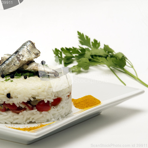 Image of rice tarte with anchovies and tomatoes filling
