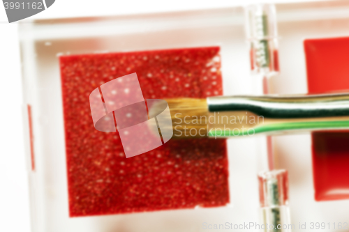 Image of red women\'s cosmetics