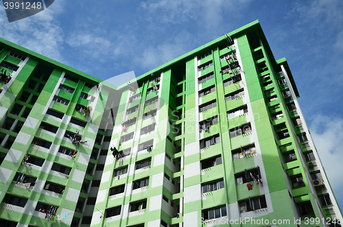 Image of Green building with blue sky