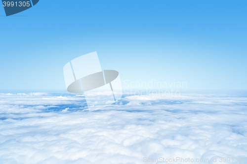 Image of flight over the clouds background