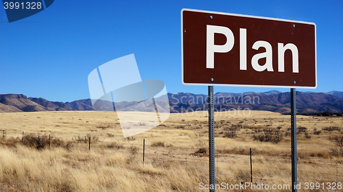 Image of Plan brown road sign