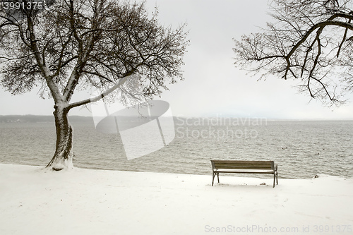 Image of bench in a snowy winter senery