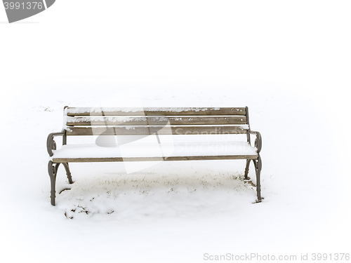Image of bench in a snowy winter senery