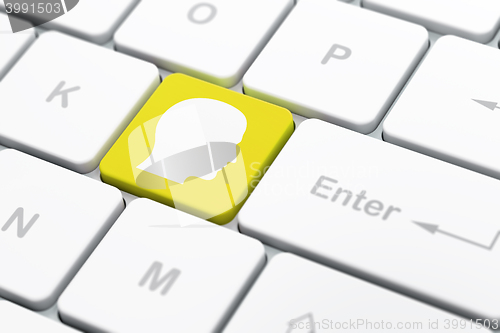 Image of Information concept: Head on computer keyboard background