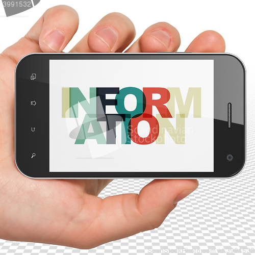 Image of Information concept: Hand Holding Smartphone with Information on  display