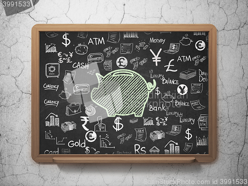 Image of Currency concept: Money Box on School board background