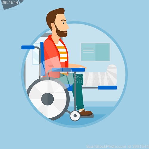 Image of Man with broken leg sitting in wheelchair.