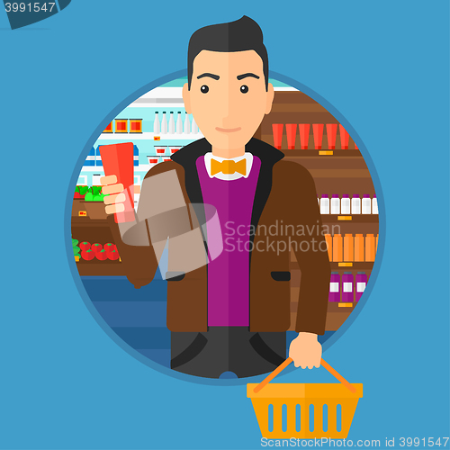 Image of Customer with shopping basket and tube of cream.