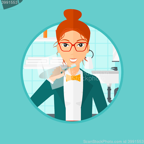 Image of Woman brushing teeth.