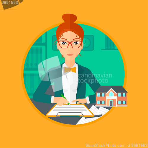 Image of Real estate agent signing contract.