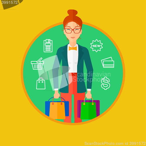 Image of Happy woman with shopping bags.