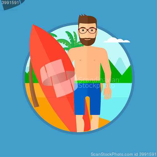 Image of Surfer holding surfboard.