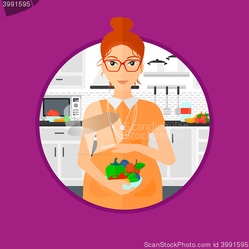 Image of Pregnant woman with vegetables and fruits.