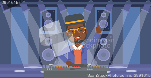 Image of Smiling DJ with console.