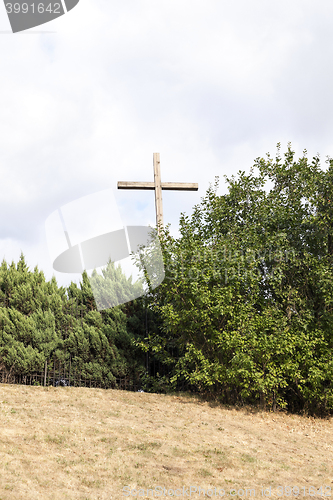 Image of wooden cross near the church