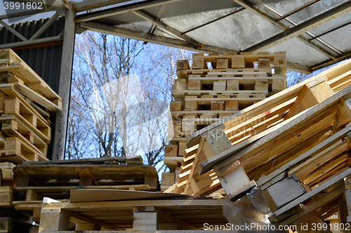 Image of Waste wood from pallets stacked in the storage room