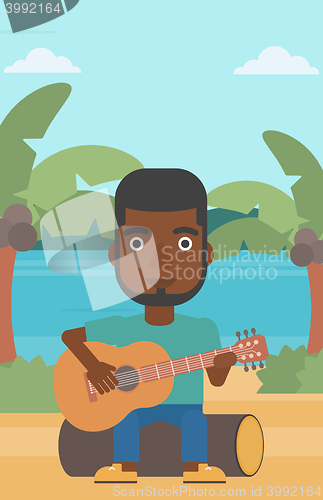 Image of Man playing guitar.