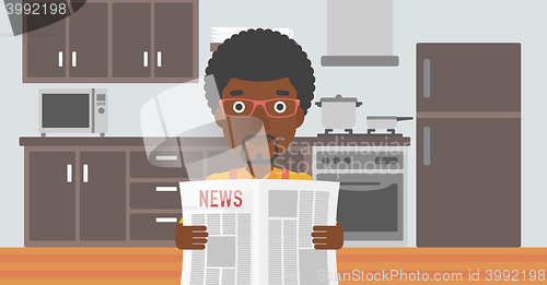 Image of Man reading newspaper.