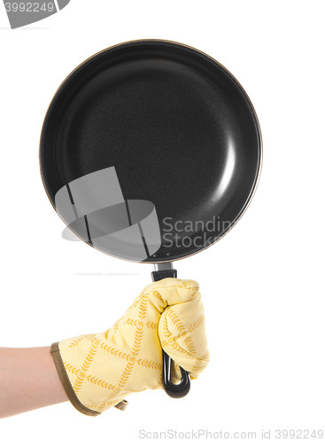 Image of hand in gloves holding pan