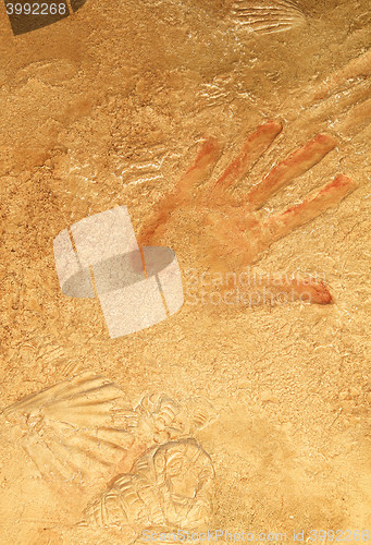 Image of Red hand print on stone