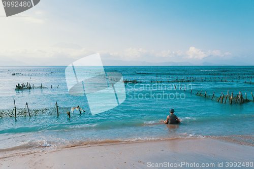 Image of Dream beach, Algae at low tide and boy